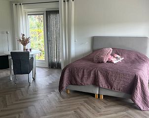 Stylish bedroom in Holiday home in Kraggenburg overlooking the garden in Flevoland.