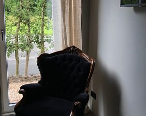 Sitting area with garden view in Holiday home in Kraggenburg, Eastern Flevoland.