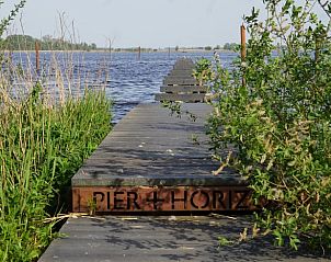 Picturesque pier at Holiday Home in Kraggenburg overlooking the water in Flevoland.