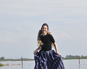 Young girl enjoys nature at cottage in Kraggenburg, Flevoland.