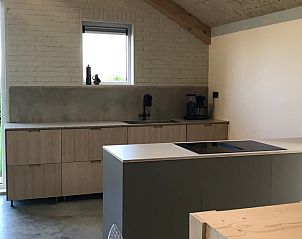 Spacious kitchen in Cottage in Kraggenburg with modern appliances in Flevoland.