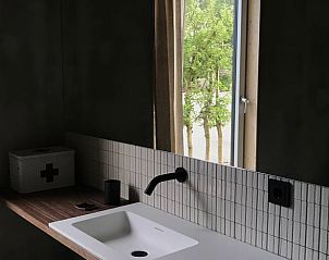 Modern bathroom with views of nature in Holiday home in Kraggenburg, Eastern Flevoland.