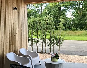 Cozy terrace with seating at Holiday home in Kraggenburg, ideal for relaxation in Flevoland.
