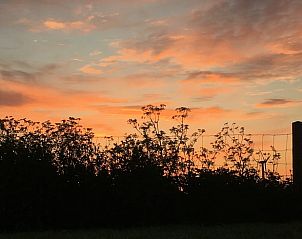 Breathtaking sunset at Holiday home in Kraggenburg, experience the beauty of Flevoland.