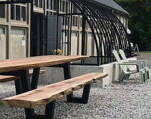 Outdoor area with seating at Holiday home in Kraggenburg, enjoy the fresh air in Eastern Flevoland.