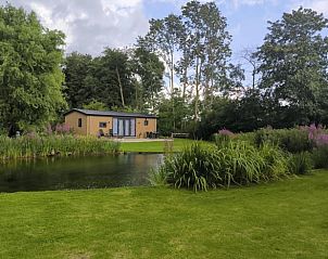 Vacation home in Kraggenburg overlooking pond and green garden in Eastern Flevoland, Flevoland.