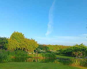 Clear blue sky over the pond at Holiday Home in Kraggenburg, Eastern Flevoland, Flevoland.