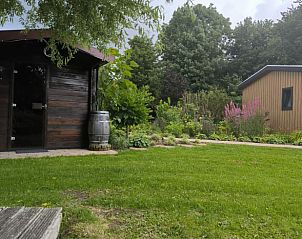 Playground with swing and trampoline at Holiday Home in Kraggenburg, Eastern Flevoland, Flevoland.