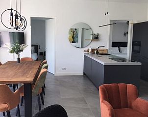 Stylish interior of Holiday Home in Zeewolde with modern kitchen and dining area.