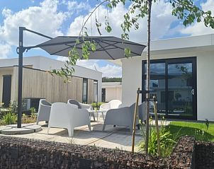 Sunny terrace at cottage in Zeewolde with comfortable seating in Flevoland.
