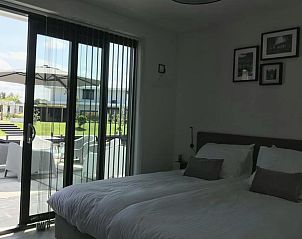Bedroom with garden view in Holiday home in Zeewolde, Flevoland.