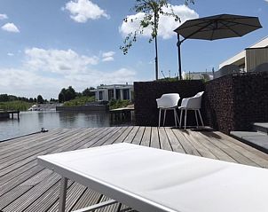 Relax by the water on the terrace of Holiday Home in Zeewolde.