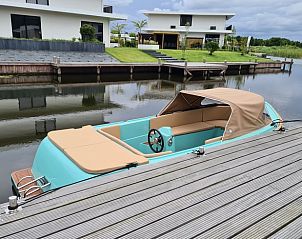 Luxury boat in front of Holiday Home in Zeewolde, Southern Flevoland.