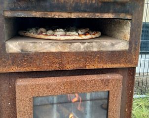 Authentic pizza oven at cottage in Zeewolde for delicious meals.