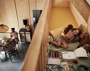 Sleeping area and dining area of Unbrick One vacation home in Appelscha, Friese bossen, Friesland.