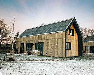 Exterior of Unbrick One vacation home in Appelscha, Frisian woods, Friesland in winter.