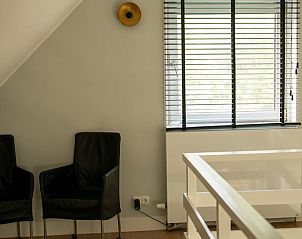 Zithoek op de bovenverdieping van Vakantiehuis in Boijl, gezellig verblijf in Friesland.