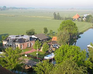 Luchtfoto van omgeving Vakantiehuisje in Poppenwier, Friese platteland, Friesland.