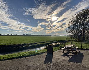 Gezellige woonkamer in vakantiehuis FR436, Longa, met comfortabele zitplaatsen en een moderne tv.