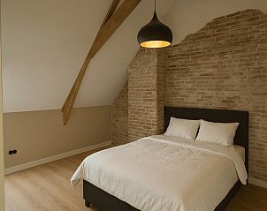 Relax in the luxurious sauna and hot tub of vacation home FR529 in Hommerts, Friesland, surrounded by the serene Frisian countryside.