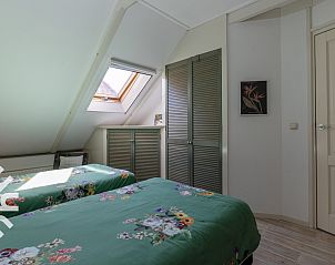 Uitzicht op de groene omgeving van FR411 vakantiehuis, Oudeschoot.