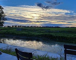 Adembenemend uitzicht vanaf het terras van Vakantiehuisje in Baaium, Friesland.