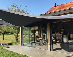 Vakantiehuis in De Hoeve met moderne buitenruimte, gelegen op het Friese platteland.