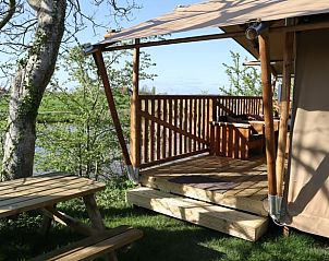 Veranda van Huisje in Wommels met uitzicht op de natuur, Friesland.