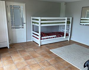 Gezellige kinderkamer met stapelbed in Vakantiehuis in Beuningen, Gelderland voor een familievriendelijke vakantie.