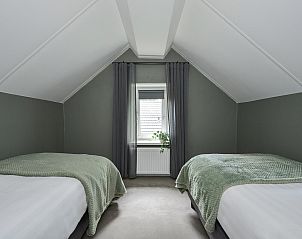 Slaapkamer met twee eenpersoonsbedden in Vrijstaande woning in Kerkdriel, Rivierengebied, Gelderland.