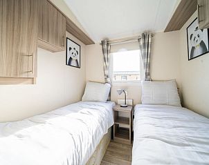 Tweepersoonskamer met aparte bedden in Vakantiehuis Berkel 4, Rivierengebied.