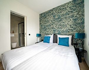 Slaapkamer met en suite badkamer in Vakantiehuis Pavilion l'etage 10, Kerkdriel, Gelderland.