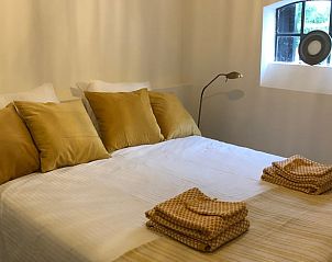 Vakantiehuisje in Buren, comfortabele slaapkamer met luxe beddengoed in Rivierengebied.