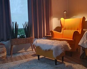 Gezellige binnenruimte van Vakantiehuis in Wolfheze, een warme sfeer in het Rivierengebied, Gelderland.