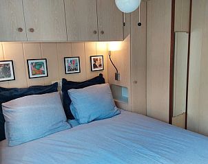 Knusse slaapkamer in Vakantiehuisje in Wolfheze met warme inrichting.