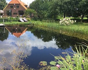 Charmante ingang van Vakantiehuisje in Toldijk, uitnodigend verblijf in Rivierengebied, Gelderland.