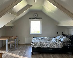 Grote slaapkamer op zolder in Vakantiehuisje in Driel, Gelderland.