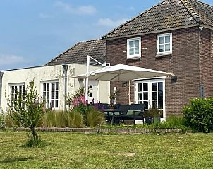 Vakantiehuis in Duiven, Gelderland met zonnig terras en groene omgeving, ideaal voor een ontspannen verblijf in het Rivierengebied.