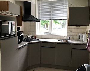 Modern kitchen in Cottage in Winterswijk, vacation home in the Achterhoek, Gelderland, overlooking the green surroundings.
