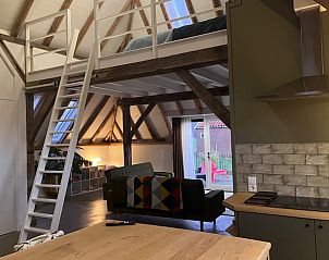 Attractive loft in Holiday Home in Winterswijk with sleeping area and access to the living room.