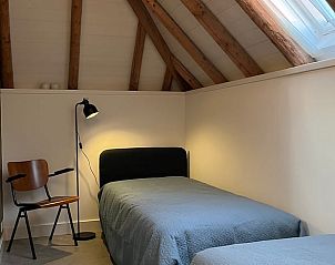 Second bedroom in Holiday Home in Winterswijk with comfortable beds and a serene feel.