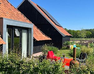 Exterior of cottage in Winterswijk with a beautiful view of the countryside.