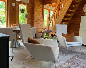 Stylish sitting area in vacation home in Winterswijk, overlooking the green surroundings of the Achterhoek, Gelderland.