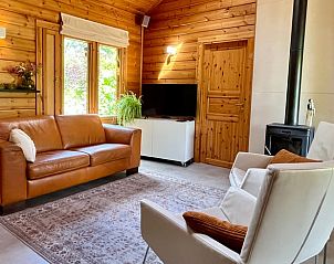 Comfortable sitting area with leather sofa in vacation home in Winterswijk, Achterhoek, Gelderland.