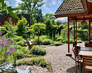 Garden with terrace at vacation home in Winterswijk, ideal for outdoor activities in Achterhoek, Gelderland.