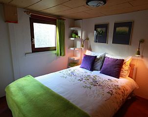 Comfortable bedroom in Holiday Home, Winterswijk, Achterhoek, with cozy furnishings and natural light.