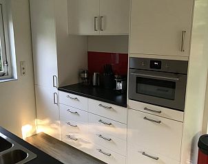 Fully equipped kitchen in Holiday Home in Winterswijk, Achterhoek, with modern appliances and plenty of storage space.