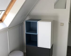 Stylish storage space in the bedroom of Holiday Home in Winterswijk, Achterhoek, with modern furnishings.