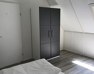 Modern closet in Holiday Home in Winterswijk, Achterhoek, provides ample storage space for guests.