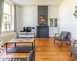 Gezellige zithoek in vakantiehuis DG693, Barchem, met stijlvolle fauteuils.